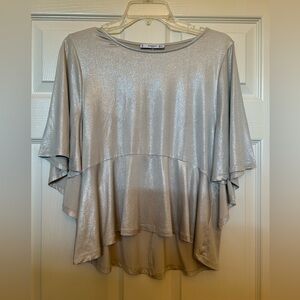 Mango Loose Fit Peplum Top. Women’s flowing top in soft shimmery beige. XS